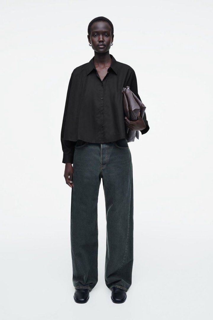 COS Black Oversized Cropped Shirt (Category: Shirts) located in Tanza. Submitted by deeclutterer (Listing ID 1450846462, Image 2). Description: - Brand: COS - Color: Black - Fit:Oversized - Style: Button-up front with collar - Sleeves: Long sleeves with button cuffs - Versatile: Looks great tucked in or worn open Good as new Fits to Small ₱1,200 only ₱3k + retail.