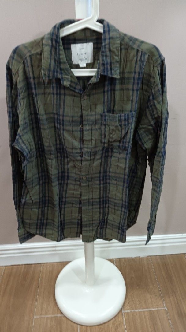 Cotton On Plaid Shirt (Category: Tshirts & Polo Shirts ) located in Quezon City. Submitted by ddgapstore (Listing ID 1450881800, Image 1). Description: - Brand: Brown & Sons - Color: Green and navy plaid - Fit: Slim fit - Style: Button-up shirt - Versatile: Great for casual wear or layering.