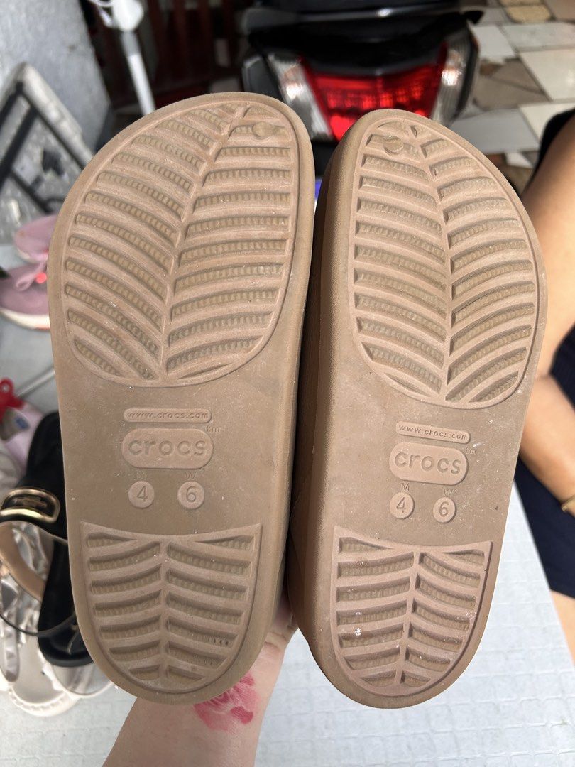 Crocs Classic Clogs Tan Size 4/6 (Category: Slippers and slides) located in Quezon City. Submitted by wonderrv18 (Listing ID 1450849011, Image 2). Description: - Classic tan Crocs clogs - Easy slip-on design - Comfortable and durable for everyday wear - Features Crocs logo and size markings on soles.