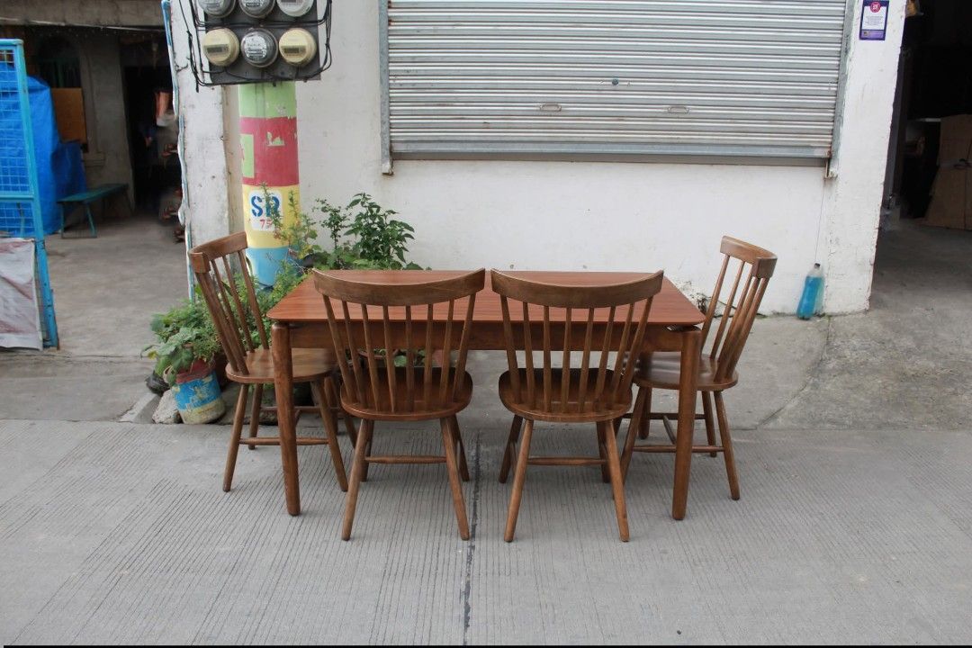 Dining Set (Category: Tables & Sets) located in Meycauayan. Submitted by marygracecasimiro (Listing ID 1450886523, Image 2). Description: Mid-Century Farmhouse Dining Set Warm wood finish and natural grain design. Rectangular dining table with rounded corners and four matching Windsor-style spindle back chairs with comfortable curved backs and sturdy wooden construction. Perfect for dining rooms, kitchens or cozy home spaces Table L:55 ¼ • W:31 ¾
