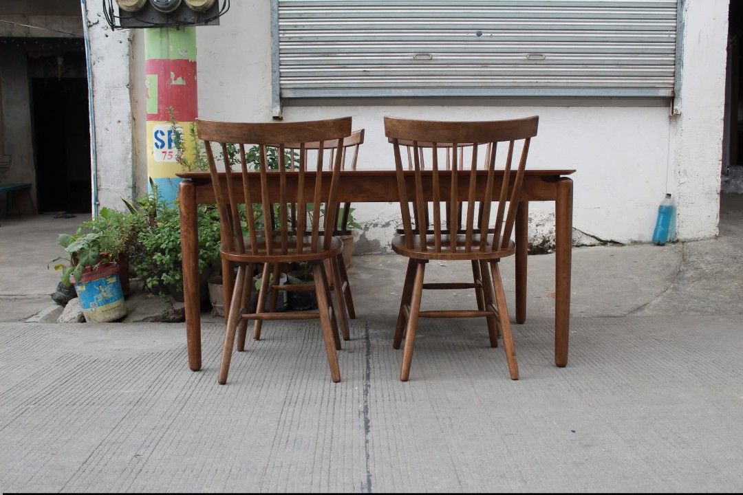 Dining Set (Category: Tables & Sets) located in Meycauayan. Submitted by marygracecasimiro (Listing ID 1450886523, Image 3). Description: Mid-Century Farmhouse Dining Set Warm wood finish and natural grain design. Rectangular dining table with rounded corners and four matching Windsor-style spindle back chairs with comfortable curved backs and sturdy wooden construction. Perfect for dining rooms, kitchens or cozy home spaces Table L:55 ¼ • W:31 ¾