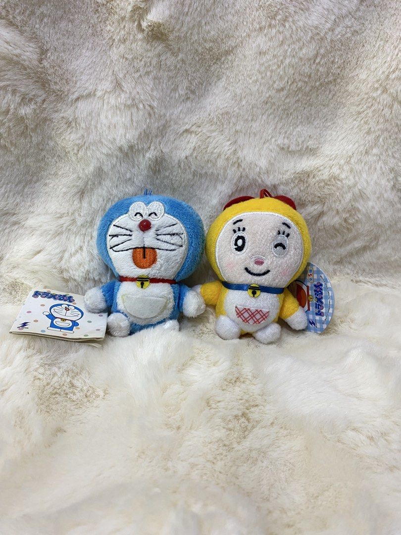 Doraemon & Dorami Plush Charm/ Keychain Set (Category: Plushies & Soft Toys) located in Kalibo. Submitted by ollie_stuffshop (Listing ID 1450739504, Image 1). Description: - Adorable Doraemon and Dorami plush toys - Comes with attached keychains - Ideal for Doraemon anime fans - Great for decorating bags or as collectibles - Both plush toys have their original tags - Sold as a set.