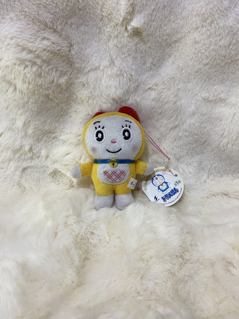 Doraemon Yellow Plush Toy with Red Bow (Category: Plushies & Soft Toys) located in Kalibo. Submitted by ollie_stuffshop (Listing ID 1450740403, Image 1). Description: Before you send your inquiries: ❗️Last Price is already posted ❗️Manage your expectations, WYSIWYG ❗️May need washing ❗️Shipping day is every Sunday - Adorable yellow Doraemon plush toy - Features a cute red bow on its head - Has a bell on its collar - Includes a special red heart d