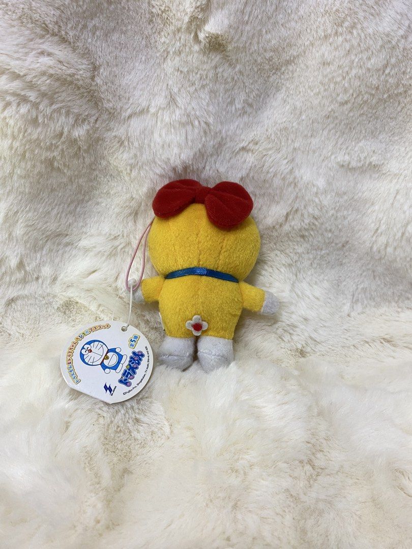 Doraemon Yellow Plush Toy with Red Bow (Category: Plushies & Soft Toys) located in Kalibo. Submitted by ollie_stuffshop (Listing ID 1450740403, Image 2). Description: Before you send your inquiries: ❗️Last Price is already posted ❗️Manage your expectations, WYSIWYG ❗️May need washing ❗️Shipping day is every Sunday - Adorable yellow Doraemon plush toy - Features a cute red bow on its head - Has a bell on its collar - Includes a special red heart d