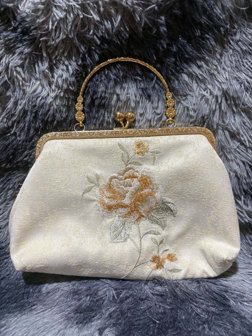 Embroidery Chinese cheongsam bag (Category: Clutches) located in Iba. Submitted by pautheamitch (Listing ID 1450818653, Image 1). Description: - Embroidery Chinese cheongsam bag. - simple elegant Chinese shoulder bag all-match female bag - Cream colored clutch bag - Beautiful floral embroidery - Chic gold frame and handle - Detachable gold chain strap included - Interior pocket for essentials - Secure clasp closure - Ideal for parties and special