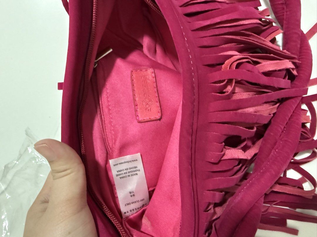 Express Pink Fringe Shoulder Bag (Category: Shoulder Bags) located in Antipolo. Submitted by jackiestash2 (Listing ID 1450872329, Image 2). Description: - Brand new pink shoulder bag - Stylish fringe detail - Unique twisted strap - Secure zipper closure - Convenient interior zip pocket - Original price: ¥149.00 Antipolo Gcash/Bdo Lalamove/J&T.