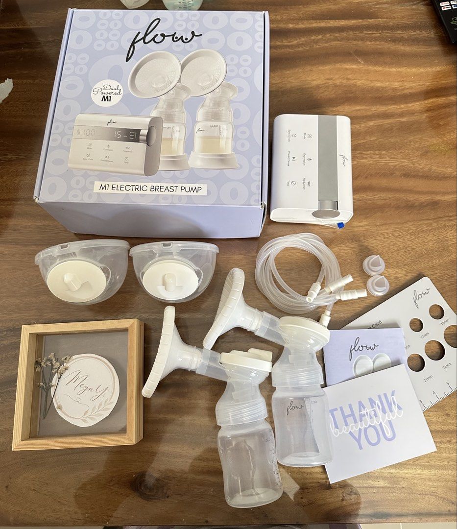 Flow M1 Electric Breast Pump 2 in 1 with freebies (Category: Breastfeeding & Bottle Feeding) located in Manila. Submitted by meynyee (Listing ID 1450759035, Image 1). Description: Selling my preloved Flow M1 2-in-1 Double Electric Hospital Grade Breast Pump. Condition: * ✅ Fully functional and working well * ✅ Complete set * ⚠️ Has slight discoloration on some parts due to UV sterilization. * ⚠️ May have minimal scratches from normal use. Complet