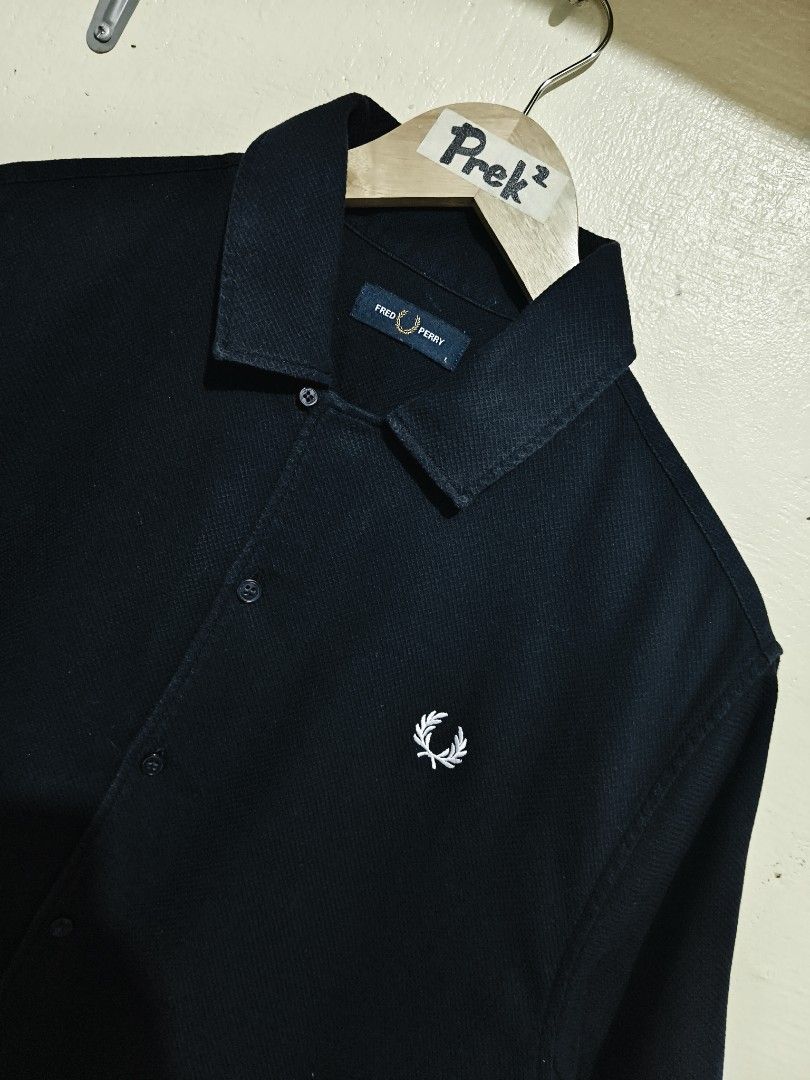 Fred Perry (Category: Activewear) located in Mandaue City. Submitted by prekfinds (Listing ID 1450870473, Image 2). Description: Fred Perry Buttondown polo shirt Excellentcondition 9.9/10colorate Size:Large on tag Dimes:23W x 27L Issue: cut wash tag but Legit No other issue No major flaws.