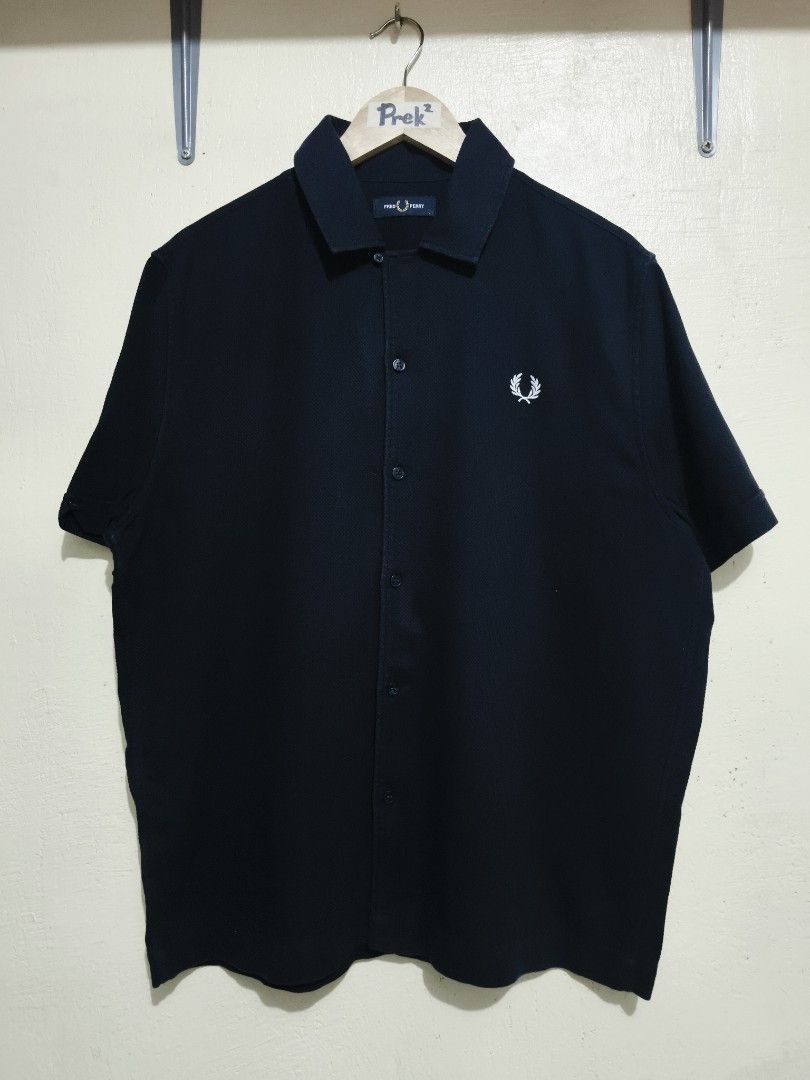 Fred Perry (Category: Activewear) located in Mandaue City. Submitted by prekfinds (Listing ID 1450870473, Image 1). Description: Fred Perry Buttondown polo shirt Excellentcondition 9.9/10colorate Size:Large on tag Dimes:23W x 27L Issue: cut wash tag but Legit No other issue No major flaws.