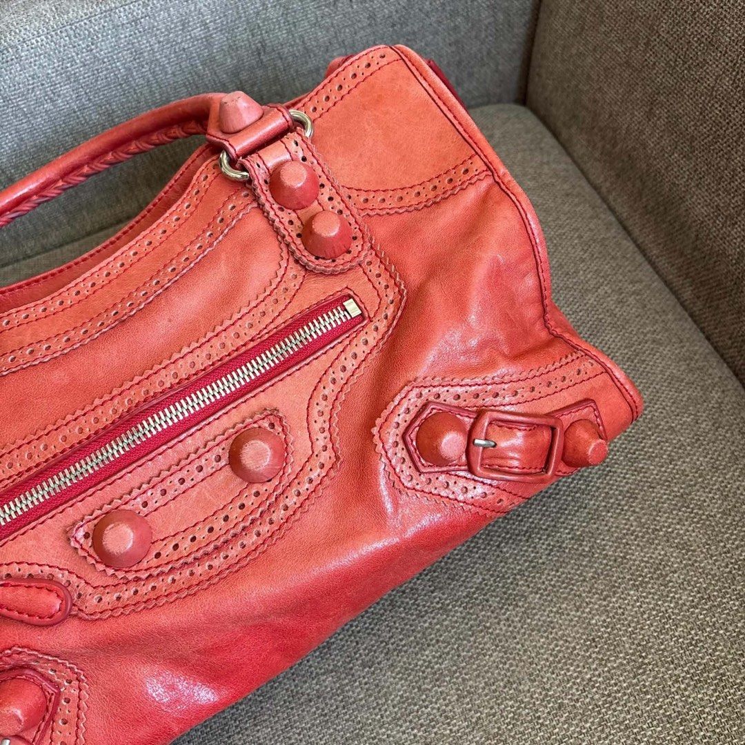 Giant Brogues City Bag (Category: Luxury Bags & Wallets) located in Quezon City. Submitted by ccloset.cleanup (Listing ID 1450831317, Image 3). Description: 💛 Slightly Negotiable 💛 Vintage Leather Studded Bag A rare sought after style and color: BALEN giant brogue covered city - coded & lampo zipped but NGA. With a red orange undertone, silver hardware and NO long strap. Needs bagspa (minimal odor - from when bought from original owner). 9/10 c