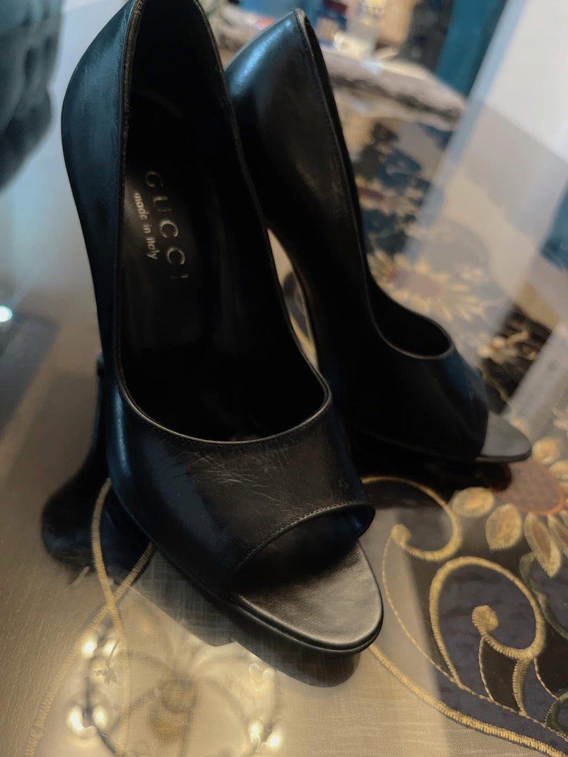 Gucci Black Leather Peep-Toe Heels (Category: Heels) located in Las Pinas. Submitted by japanthriftstore (Listing ID 1450845859, Image 1). Description: - Brand: Gucci - Material: Black Leather - Style: Peep-toe Heels - Size: 5B - Origin: Made in Italy - Features: Classic, versatile style..