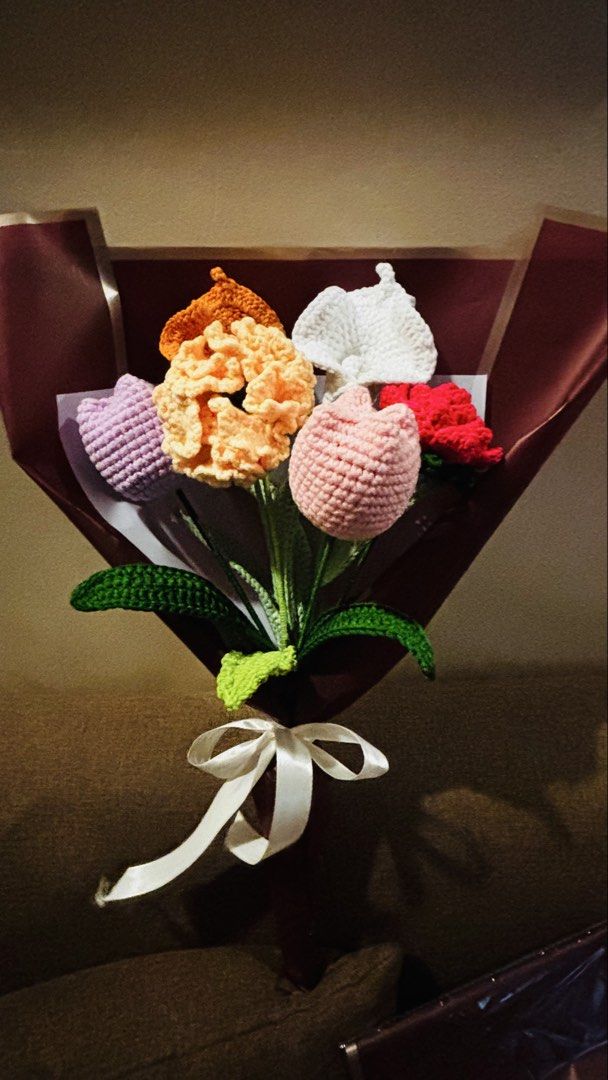 Handmade Crocheted Flower Bouquet - Unique Gift (Category: Flowers & Bouquets) located in Manila. Submitted by candygurl18 (Listing ID 1450827725, Image 1). Description: Beautiful handmade crocheted flower bouquet. Features a mix of colorful flowers like tulips and calla lilies. Wrapped in dark red and brown paper with a white ribbon tie. Great as a gift or for home decor. No two bouquets are exactly alike. Each flower is carefully crafted..