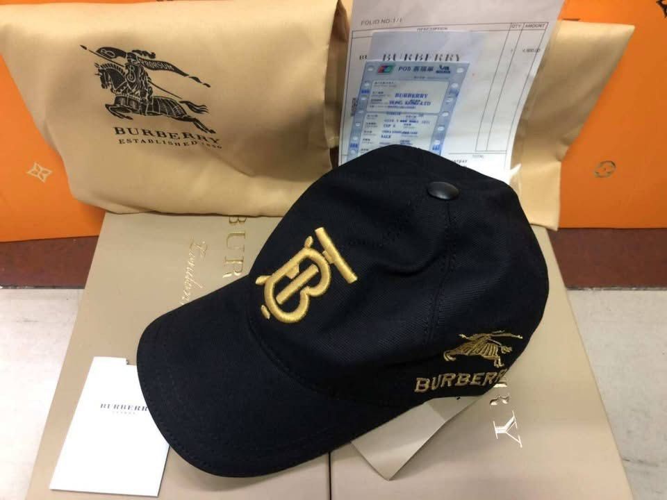 Hermes Black Cap with Orange Trim (Category: Caps & Hats) located in Manila. Submitted by grandfish_847280 (Listing ID 1450933716, Image 2). Description: Black cap with orange trim. Features the iconic 'H' logo embroidered on the front. Comes with dust bag and authenticity papers. Great for casual wear..