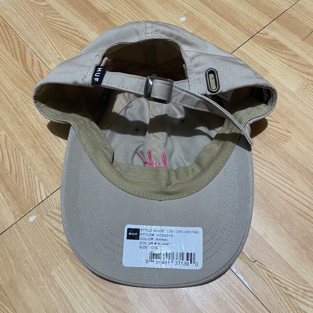 Huf Script Curve Visor 6 Panel Cap - Khaki (Category: Caps & Hats) located in Manila. Submitted by killthismane (Listing ID 1450919110, Image 3). Description: This is a HUF Script Curve Visor 6 Panel Cap in khaki, featuring a distinctive embroidered pink logo on the front. Need Wash.