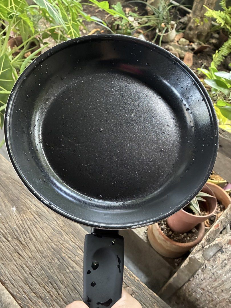 IKEA Black Non-Stick Frying Pan with Handle (Category: Cookware & Accessories) located in Cavite. Submitted by secondhandnook (Listing ID 1450848613, Image 1). Description: - Black frying pan - Non-stick surface for easy cooking and cleaning - Comfortable grip handle - Ideal for everyday meals - Pre-loved and ready for its next kitchen adventure.