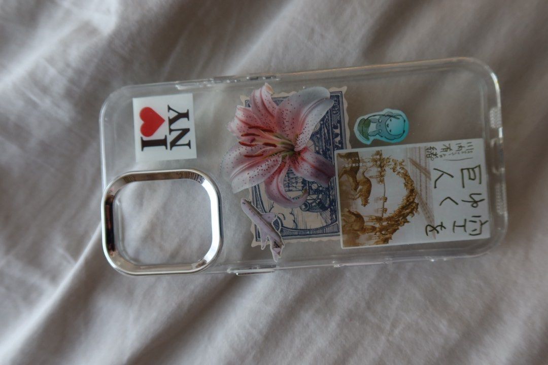 IPhone 16 plus Aesthetic Case (Category: Cases & Sleeves) located in Pasig City. Submitted by ameliaaxa (Listing ID 1450812675, Image 2). Description: Designed Case from an art workshop - Super Cute! - Flowers, I ❤️ NYC & JPN elements - New .