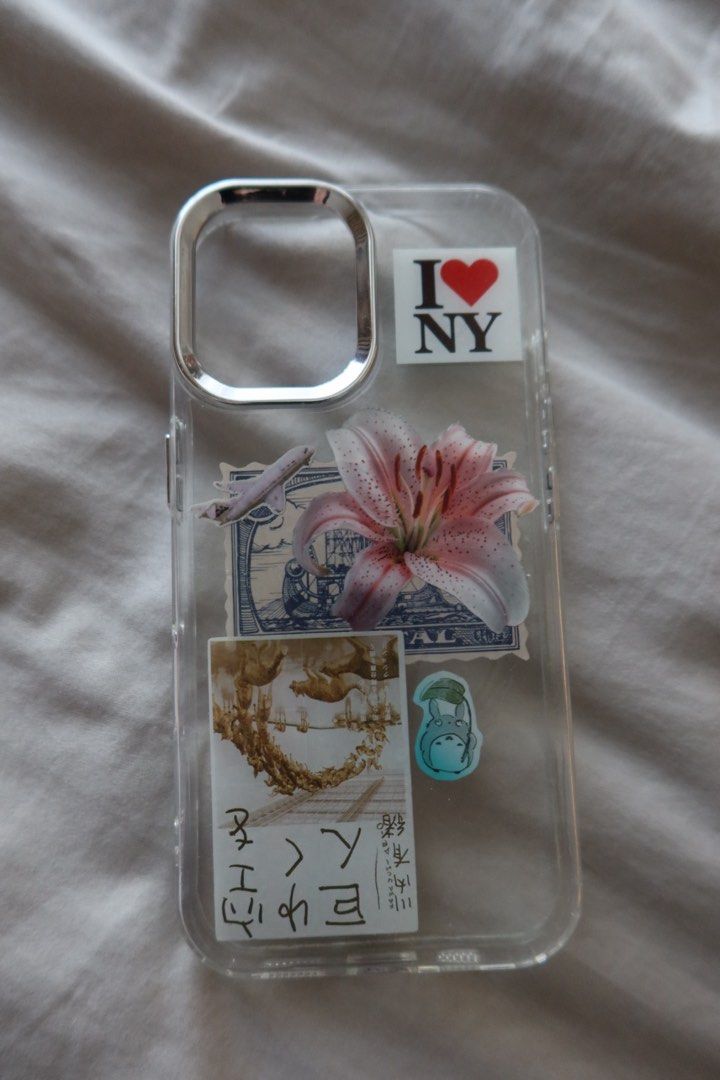 IPhone 16 plus Aesthetic Case (Category: Cases & Sleeves) located in Pasig City. Submitted by ameliaaxa (Listing ID 1450812675, Image 1). Description: Designed Case from an art workshop - Super Cute! - Flowers, I ❤️ NYC & JPN elements - New .