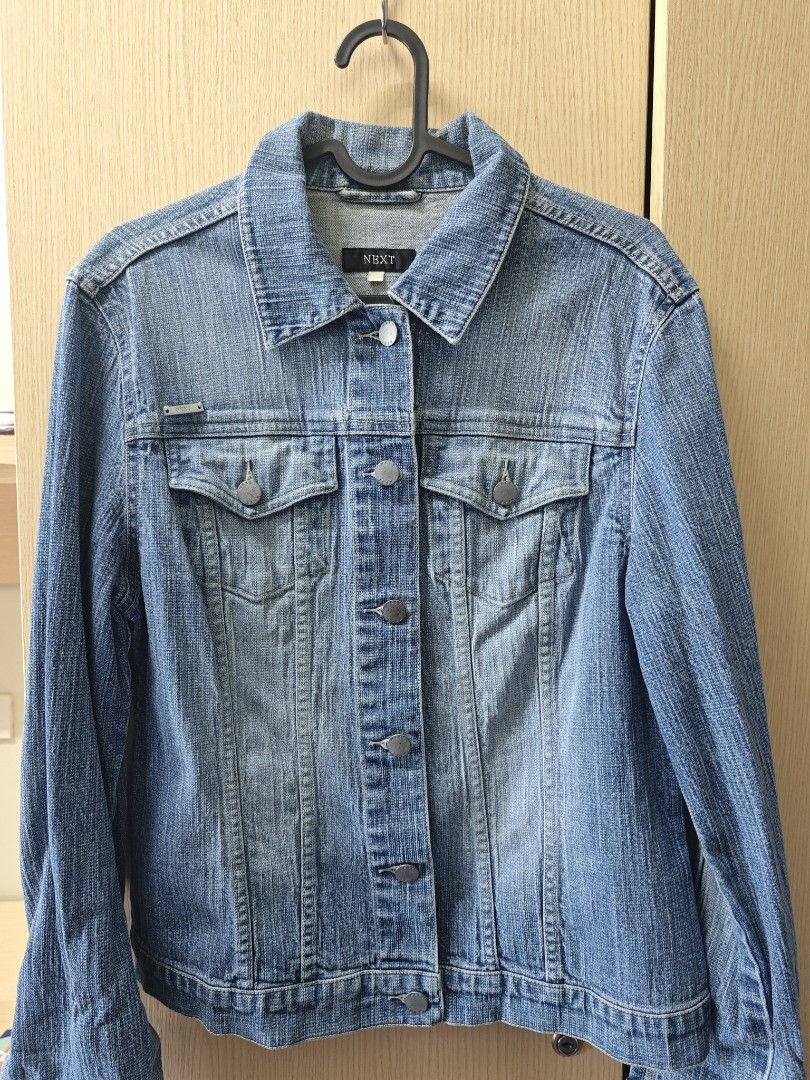 Jeans Denim Jacket (Category: Coats, Jackets and Outerwear) located in Taguig. Submitted by hellojuly (Listing ID 1450776318, Image 1). Description: - Classic blue denim jacket - Button-up front - Two chest pockets - Standard fit - Ideal for layering over t-shirts or sweaters - Versatile for any wardrobe - Perfect for casual outings.