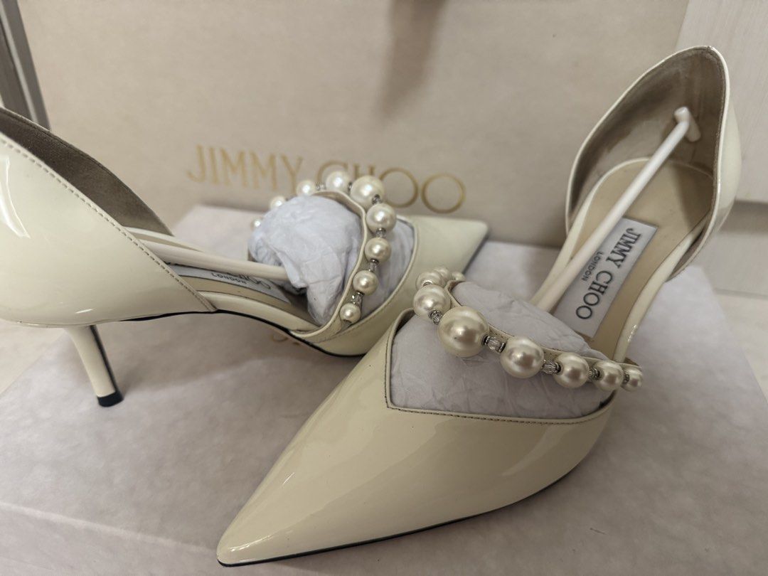 Jimmy Choo Heels (Category: Heels) located in Makati City. Submitted by mnncl (Listing ID 1450897403, Image 1). Description: Used once during my wedding / church ceremony (used for 1 hr - Brand: Jimmy Choo - Material: Patent Leather - Size: 36.5 - Embellishments: Pearls and rhinestones across the front - Toe Style: Pointed toe - Heel Height: Low heel - Includes: Original box, something blue dust bag, 2 shoes dust bags and paper bag - Bought in It