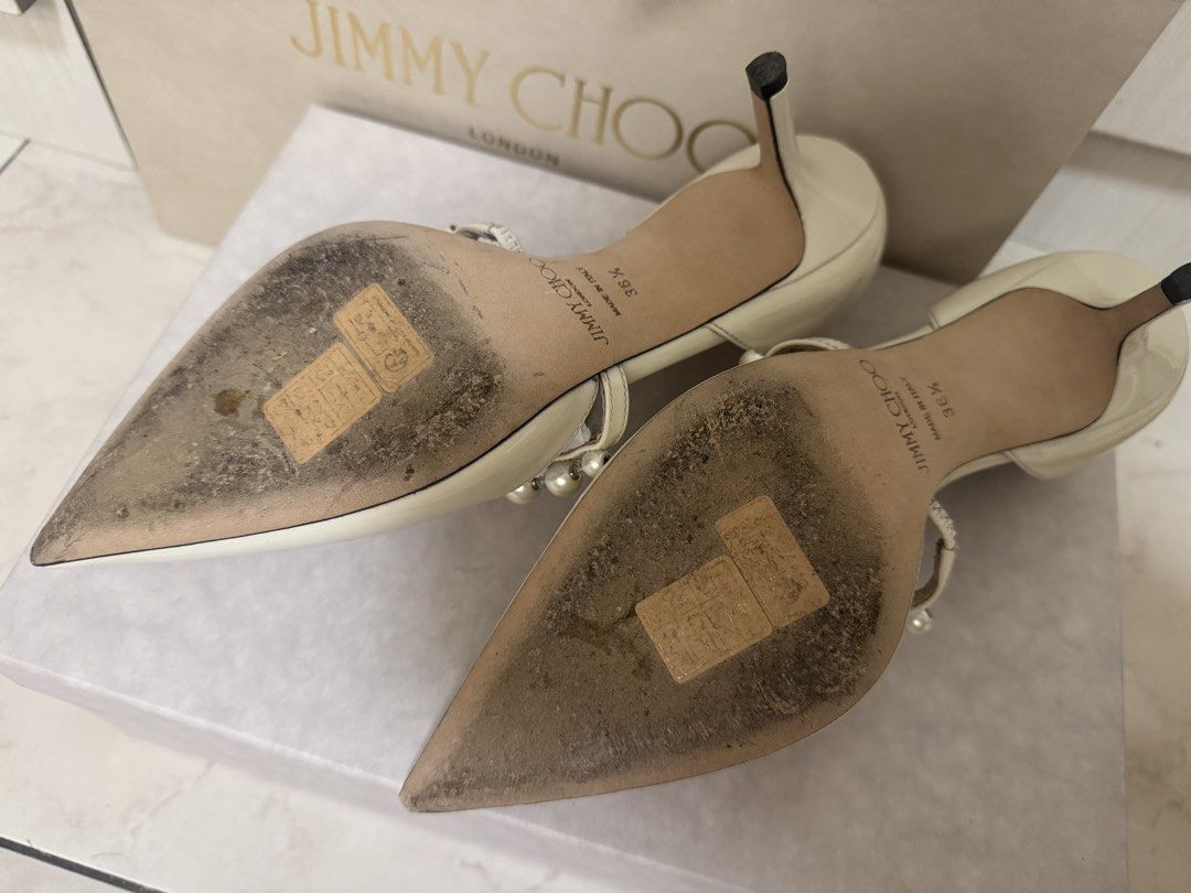 Jimmy Choo Heels (Category: Heels) located in Makati City. Submitted by mnncl (Listing ID 1450897403, Image 3). Description: Used once during my wedding / church ceremony (used for 1 hr - Brand: Jimmy Choo - Material: Patent Leather - Size: 36.5 - Embellishments: Pearls and rhinestones across the front - Toe Style: Pointed toe - Heel Height: Low heel - Includes: Original box, something blue dust bag, 2 shoes dust bags and paper bag - Bought in It