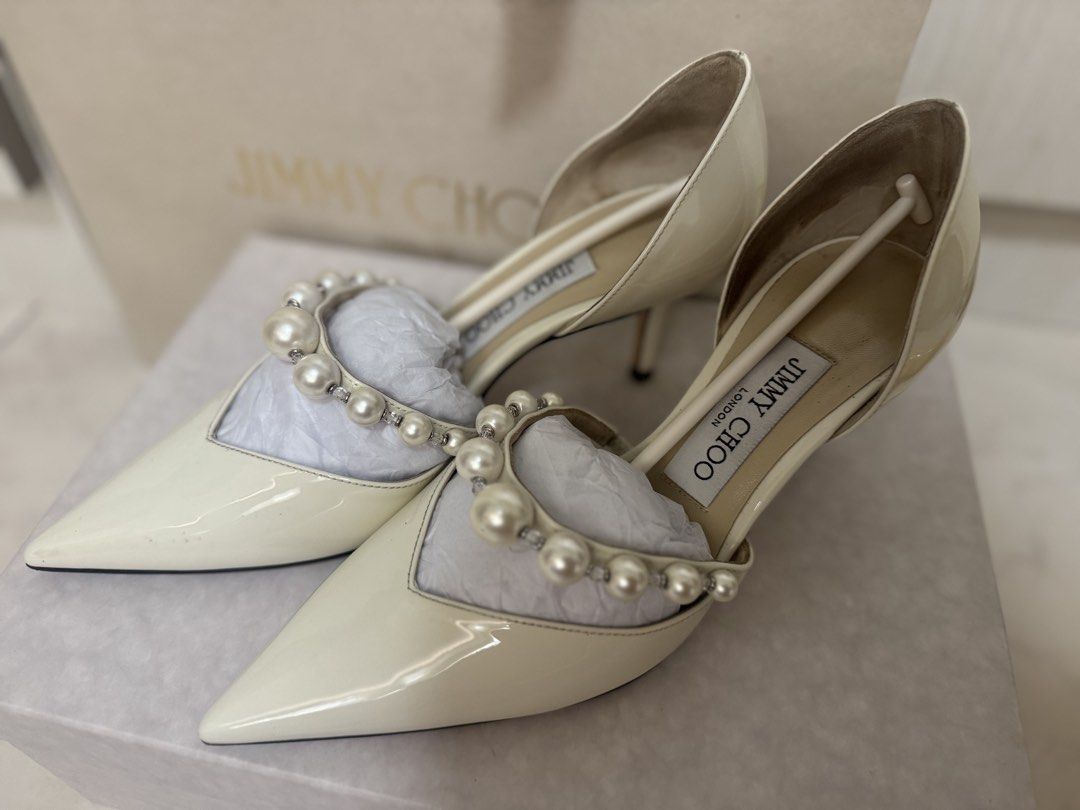 Jimmy Choo Heels (Category: Heels) located in Makati City. Submitted by mnncl (Listing ID 1450897403, Image 2). Description: Used once during my wedding / church ceremony (used for 1 hr - Brand: Jimmy Choo - Material: Patent Leather - Size: 36.5 - Embellishments: Pearls and rhinestones across the front - Toe Style: Pointed toe - Heel Height: Low heel - Includes: Original box, something blue dust bag, 2 shoes dust bags and paper bag - Bought in It
