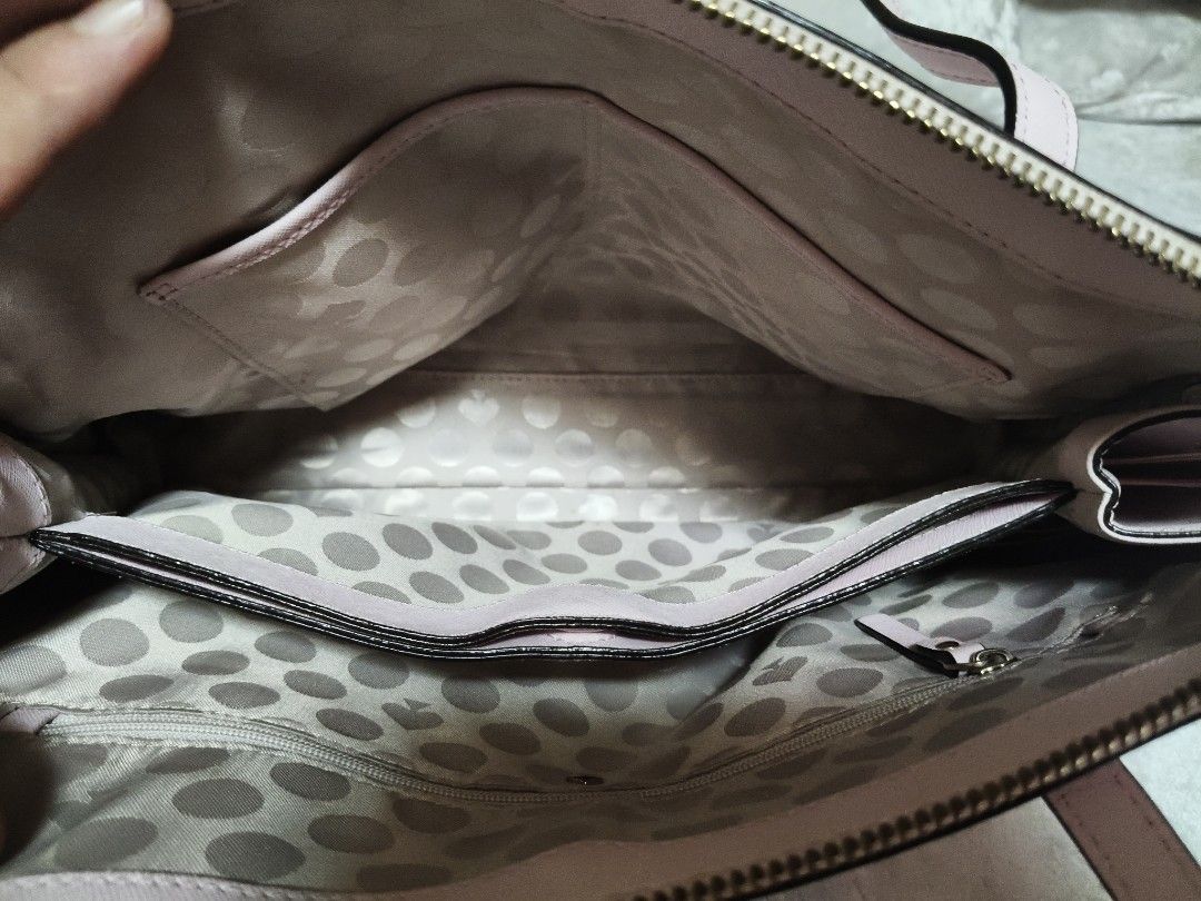 Kate Spade Pink Leather Dome Satchel Handbag (Category: Luxury Bags & Wallets) located in Mexico. Submitted by indaymurayta888 (Listing ID 1450737274, Image 2). Description: - Authentic Kate Spade handbag - Lovely light pink color - Textured leather exterior - Interior with charming polka dot lining - Multiple interior pockets for organization - Secure zipper closure - Protective metal feet on the bottom - Comes with original dust bag - Includes 