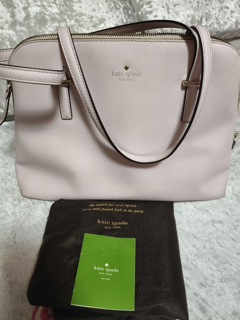 Kate Spade Pink Leather Dome Satchel Handbag (Category: Luxury Bags & Wallets) located in Mexico. Submitted by indaymurayta888 (Listing ID 1450737274, Image 1). Description: - Authentic Kate Spade handbag - Lovely light pink color - Textured leather exterior - Interior with charming polka dot lining - Multiple interior pockets for organization - Secure zipper closure - Protective metal feet on the bottom - Comes with original dust bag - Includes 