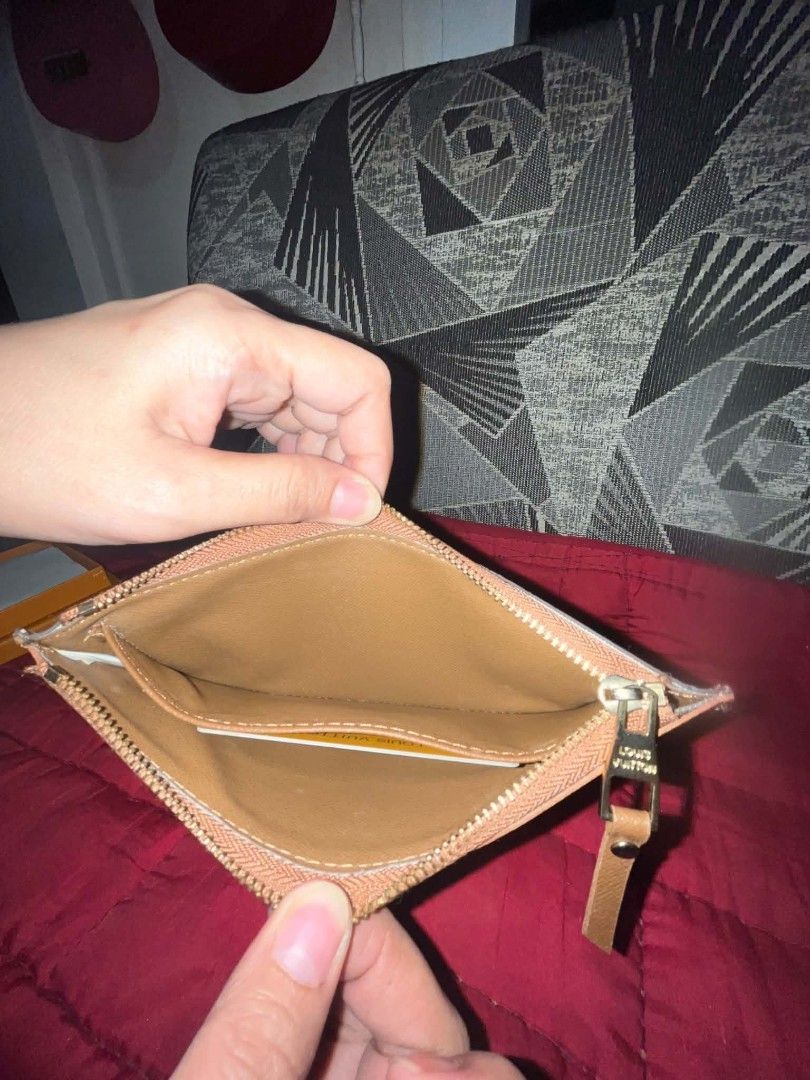 Louis Vuitton Monogram Canvas Pouch (Category: Luxury Bags & Wallets) located in Quezon City. Submitted by kinopipanda (Listing ID 1450903511, Image 3). Description: Louis Vuitton wallet - Classic Monogram canvas exterior - Interior features card slots and a zip pocket - Comes with box - Ideal for organizing your daily essentials.