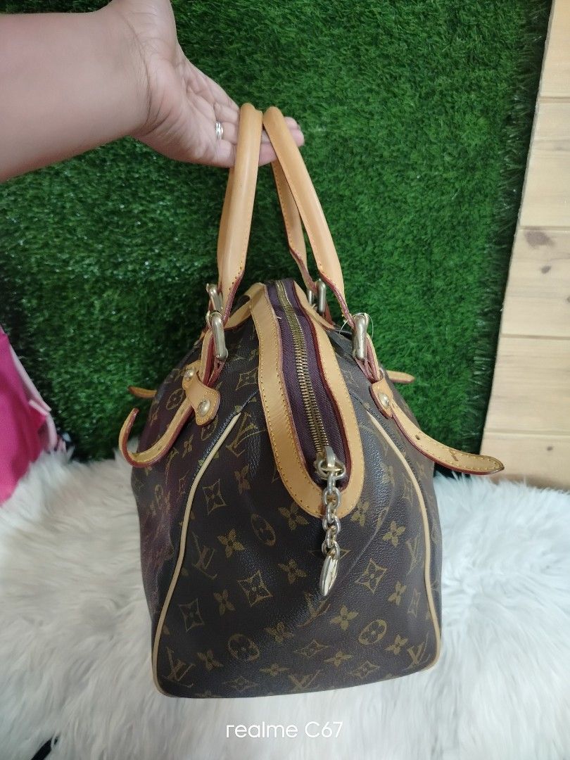 Louis Vuitton Monogram Tivoli (Category: Luxury Bags & Wallets) located in Bacolod City. Submitted by Mike23MattPreloved (Listing ID 1450823785, Image 2). Description: - Classic Louis Vuitton Speedy bag - Monogram canvas with vachetta leather trim and handles - Secure zipper closure with a cute charm - Spacious interior for essentials - Timeless and perfect for everyday use.