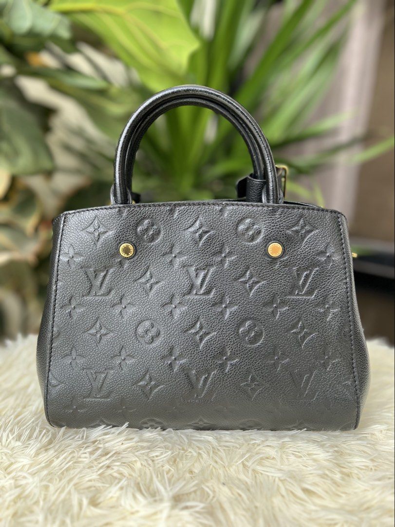 Louis Vuitton Montaigne BB in Black Empreinte Leather (Category: Luxury Bags & Wallets) located in Cagayan de Oro. Submitted by orocurations (Listing ID 1450794264, Image 3). Description: - This is a Louis Vuitton Montaigne BB handbag crafted from black Monogram Empreinte leather, featuring signature embossed monogramming and sleek gold hardware. - Inclusions: detachable shoulder/crossbody strap, leather clochette, two keys, LV padlock, original 