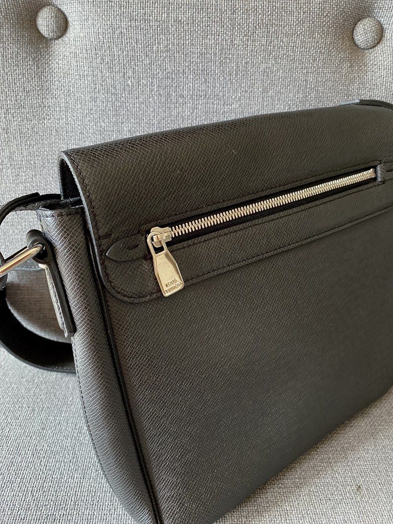 Louis Vuitton Taiga Leather Messenger Bag (Category: Luxury Bags & Wallets) located in Makati City. Submitted by lucid_soul (Listing ID 1450775018, Image 3). Description: - Authentic Louis Vuitton messenger bag - Color: Black - Material: Taiga leather - Exterior: Front zip pocket - Interior: Main compartment, slip pocket - Strap: Adjustable shoulder strap Excellent condition, no stains, no cracks, no scratches. Lived in Bali 3 years during COVID 