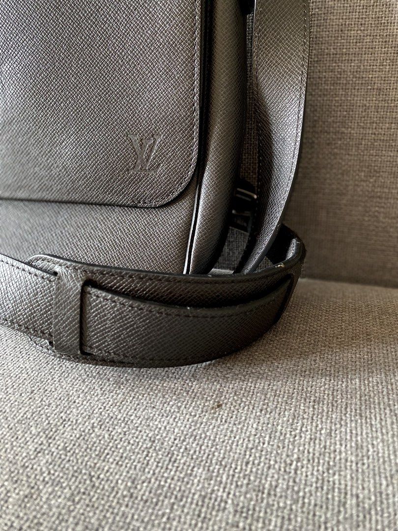 Louis Vuitton Taiga Leather Messenger Bag (Category: Luxury Bags & Wallets) located in Makati City. Submitted by lucid_soul (Listing ID 1450775018, Image 2). Description: - Authentic Louis Vuitton messenger bag - Color: Black - Material: Taiga leather - Exterior: Front zip pocket - Interior: Main compartment, slip pocket - Strap: Adjustable shoulder strap Excellent condition, no stains, no cracks, no scratches. Lived in Bali 3 years during COVID 