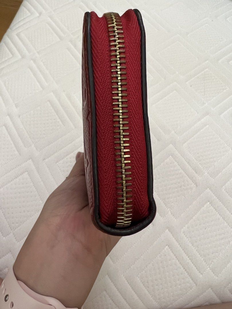 Louis Vuitton Zippy Wallet in Red Monogram Empreinte (Category: Luxury Bags & Wallets) located in Taguig. Submitted by PF910 (Listing ID 1450738730, Image 3). Description: Bought in Japan 2017. Well loved & used over the years but I prefer smaller wallets now. I was only able to keep the dustbag, but l’ll be able to give you a paperbag if ever. Meetup at Serendra to check the item. - Authentic Louis Vuitton Wallet - Color: Red - Material: Monogra