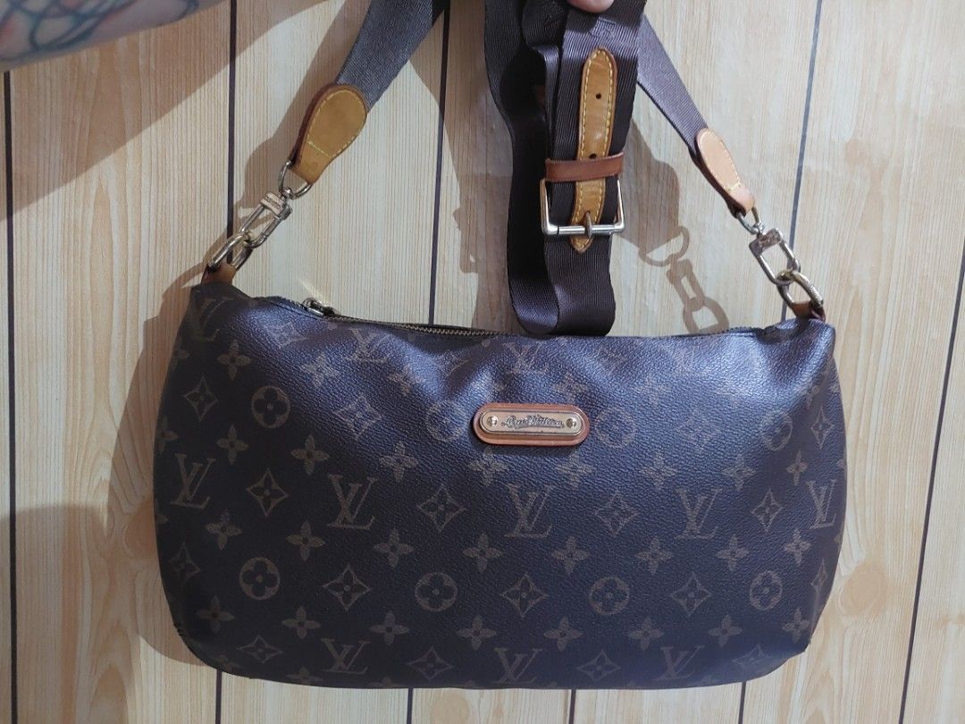 LV Banana/Eva Clutch (Category: Luxury Bags & Wallets) located in Manila. Submitted by 09kimberly11 (Listing ID 1450762796, Image 1). Description: - Aligned monogram print - Classic Louis Vuitton monogram convertible bag - No rubs on leather, intact rubber lining - Color: Brown canvas with leather trim - with distinct heat stamp Serial Number - Features: Adjustable shoulder strap with buckle detail, gold-tone hardware - Closure: Secure zipper - I