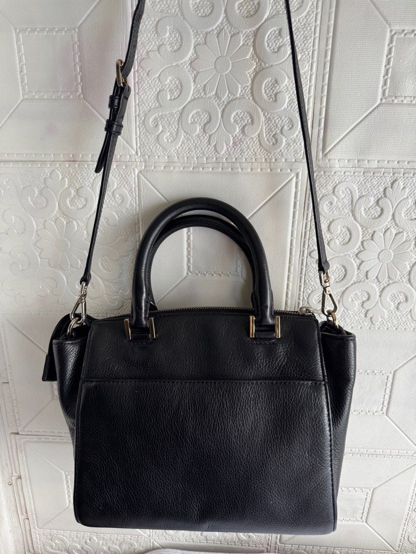 Michael Kors Black Leather Leopard Print Satchel Bag (Category: Cross-body Bags) located in Pasig City. Submitted by weng0952 (Listing ID 1450859146, Image 2). Description: - Michael Kors satchel bag - Black pebbled leather with leopard print front panel - Gold hardware details - Top handles and detachable crossbody strap - Zipper closure - Interior pockets - Versatile for everyday or evening use.