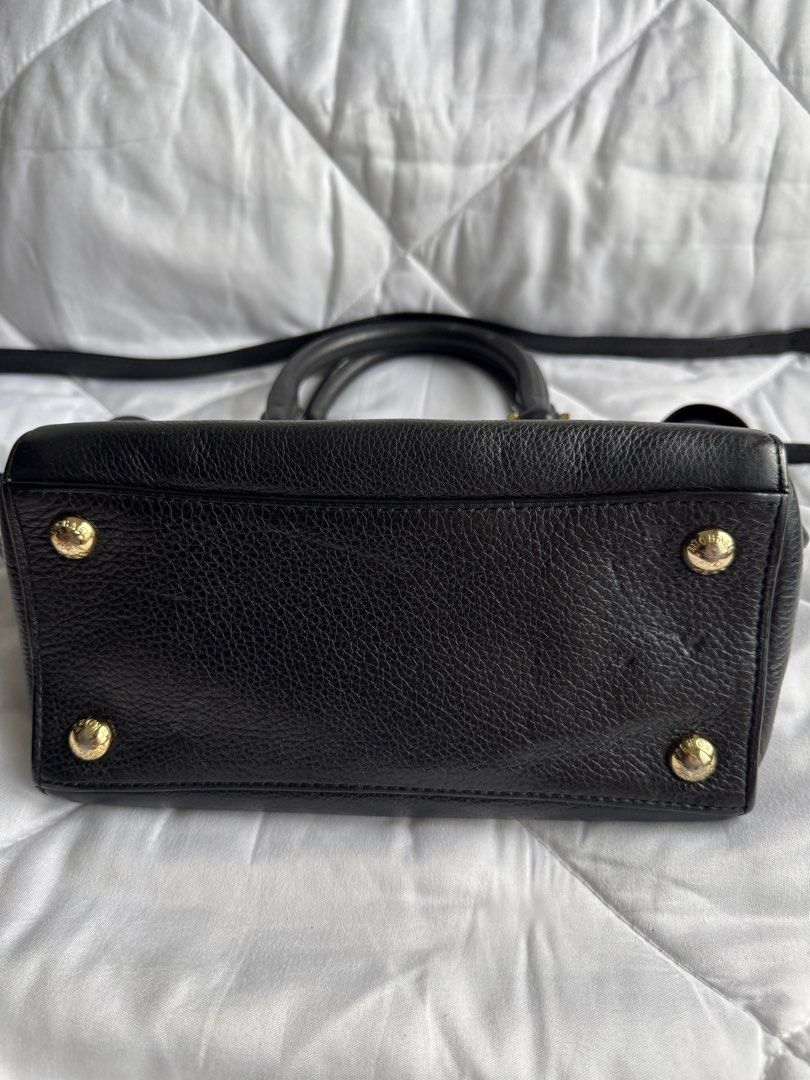 Michael Kors Black Leather Leopard Print Satchel Bag (Category: Cross-body Bags) located in Pasig City. Submitted by weng0952 (Listing ID 1450859146, Image 3). Description: - Michael Kors satchel bag - Black pebbled leather with leopard print front panel - Gold hardware details - Top handles and detachable crossbody strap - Zipper closure - Interior pockets - Versatile for everyday or evening use.