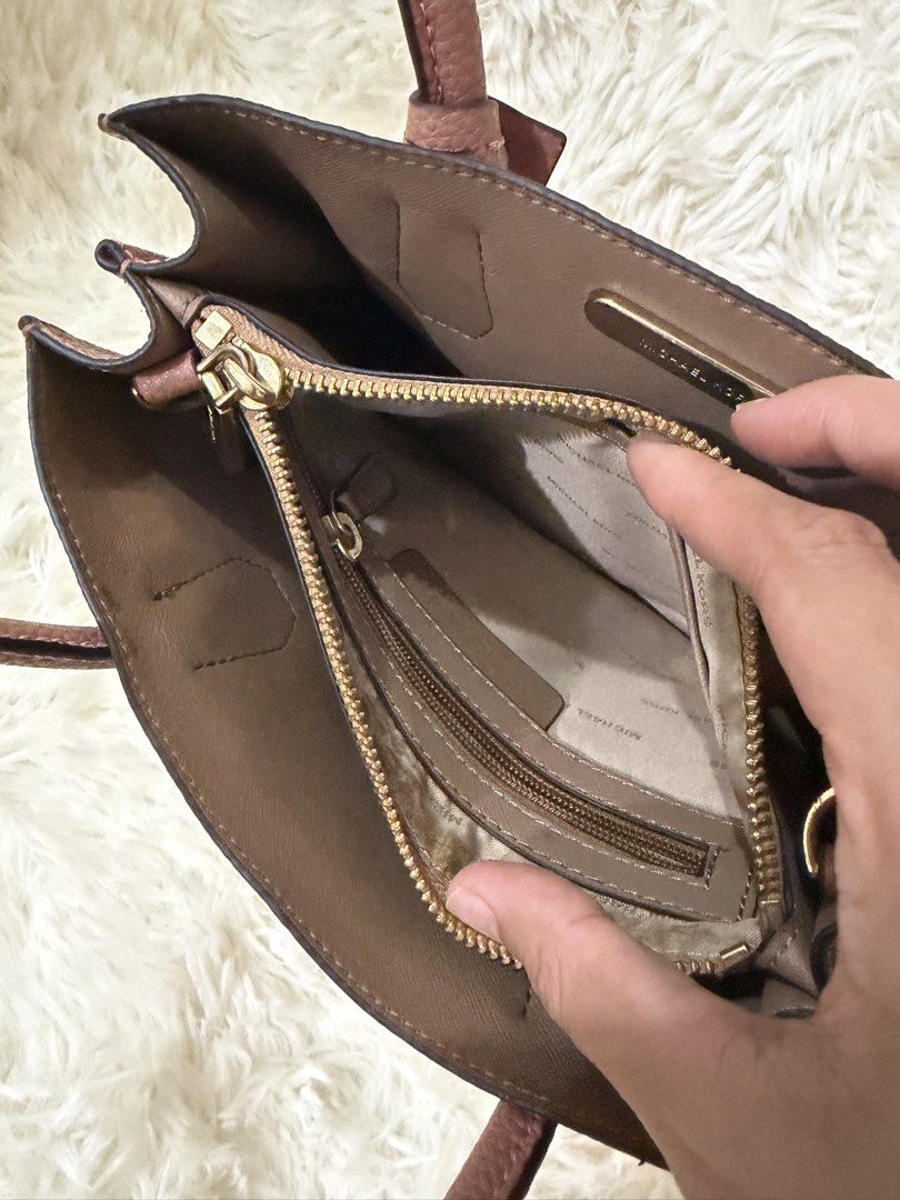 Michael Kors Pink Pebbled Leather Tote Bag (Category: Luxury Bags & Wallets) located in Cebu City. Submitted by myclosettoyours_cebu (Listing ID 1450916923, Image 3). Description: - Authentic Michael Kors tote bag - Lovely pink pebbled leather exterior Interior is still very clean. No strap included, lightly faded due to storage hence selling super low.