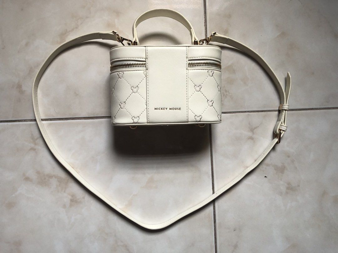 micky mouse sling bag + secosana wallet (Category: Cross-body Bags) located in Pasig City. Submitted by teddae (Listing ID 1450741068, Image 3). Description: micky mouse sling makeup bag - white (color may vary due to lighting) - authentic secosana wallet - black color - authentic rately used, no flaws free secosana wallet 1k for both can do COD/Gcash mop or meetup if nearby -buyer will handle the shipping fee-.