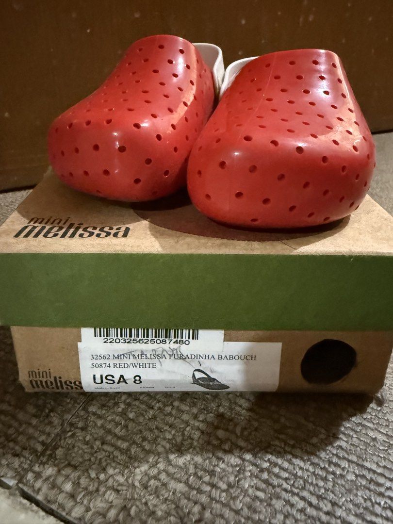 Mini Melissa Red Strawberry Clogs Babouch USA 8 (Category: Babies & Kids Fashion) located in Talisay. Submitted by grazelle_1985 (Listing ID 1450871598, Image 2). Description: - Adorable red clogs from Mini Melissa - Fun strawberry design with ventilation holes - Secure white back strap - Original box included - Size: USA 8.