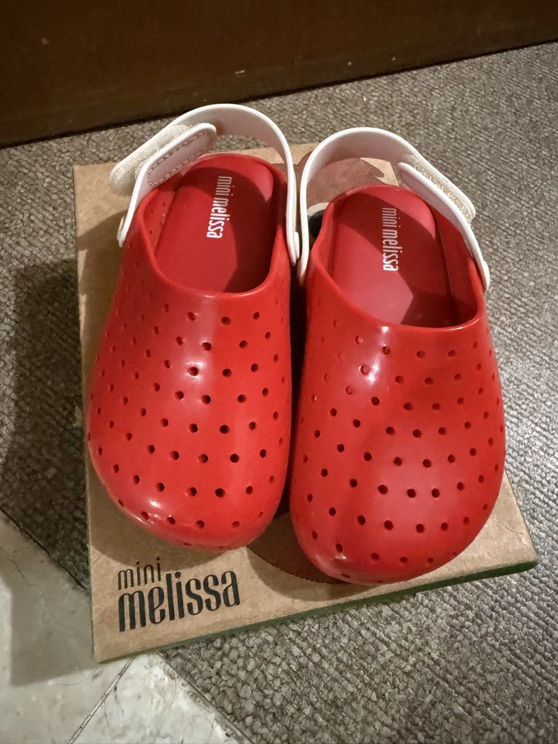Mini Melissa Red Strawberry Clogs Babouch USA 8 (Category: Babies & Kids Fashion) located in Talisay. Submitted by grazelle_1985 (Listing ID 1450871598, Image 1). Description: - Adorable red clogs from Mini Melissa - Fun strawberry design with ventilation holes - Secure white back strap - Original box included - Size: USA 8.
