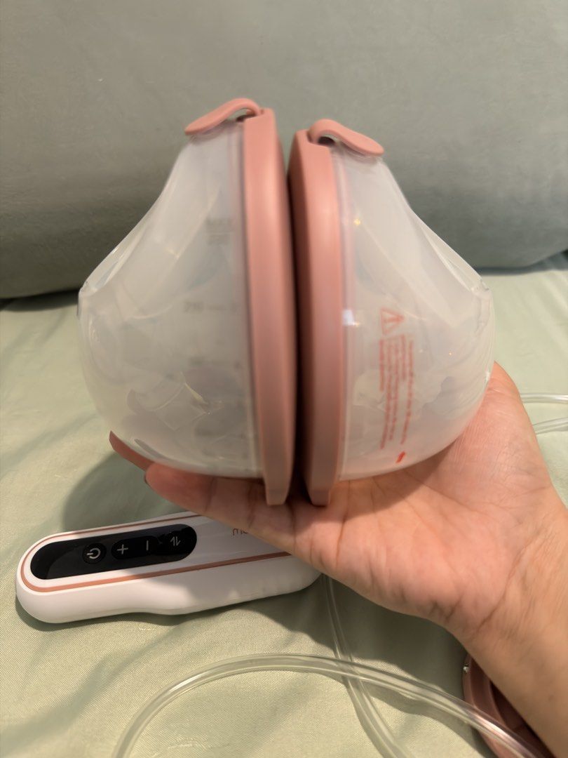 Momcozy V2Pro Wearable Breast Pump Set (Category: Breastfeeding & Bottle Feeding) located in Paranaque City. Submitted by alyysa.chr (Listing ID 1450894716, Image 3). Description: - Momcozy wearable breast pump set - Includes 2 pumps, tubing, and controller - Comes with Dapple Baby breast pump wipes - Ideal for convenient, on-the-go pumping - Easy to use and clean Will give additional breastpump wipes bought from amazon for free.