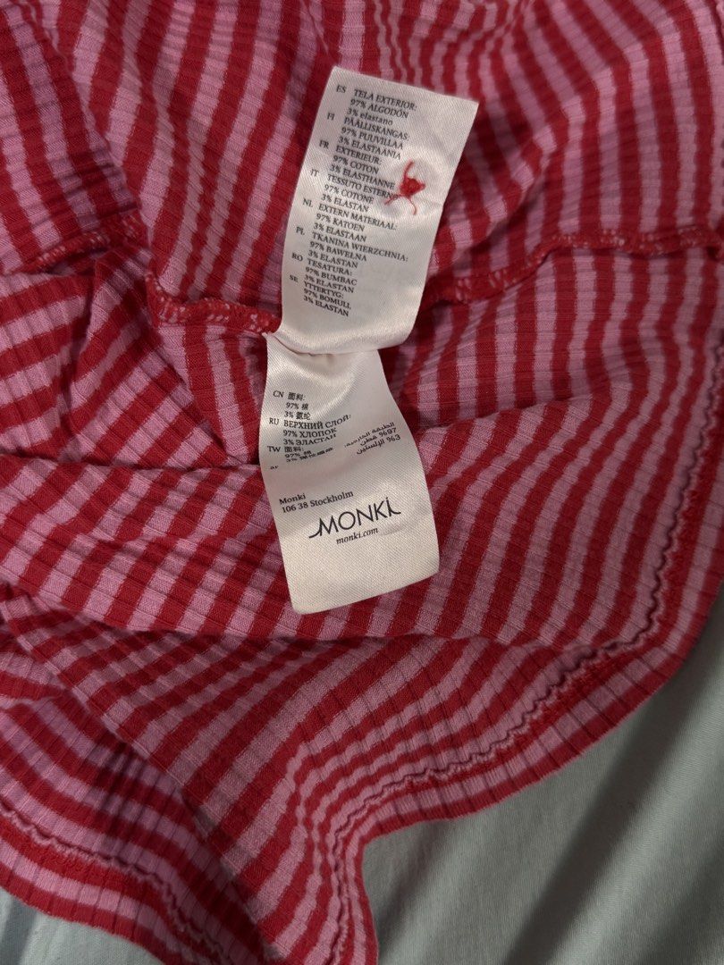 Monki Pink Red Striped Ribbed Button Up Crop Top (Category: Blouses) located in Quezon City. Submitted by nellienells (Listing ID 1450771746, Image 3). Description: - Cute pink and red striped crop top - Brand: Monki - Material: Ribbed - Features: Button-up front, short sleeves, scoop neckline - Style: Versatile for casual outings or nights out - Pair with: High-waisted jeans or skirts.