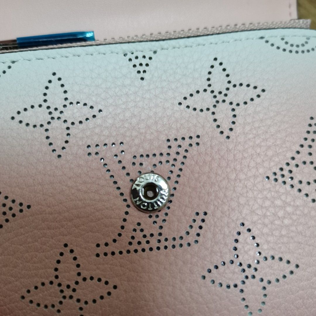 Monogram Perforated Pink Wallet (Category: Wallets & Card holders) located in Kajang. Submitted by estee_st (Listing ID 1450737381, Image 2). Description: - Pink L. V Wallet - Classic Monogram Pattern with Perforations - Secure Snap Button Closure - Interior Zipped Compartment - Multiple Card Slots - Made in France.