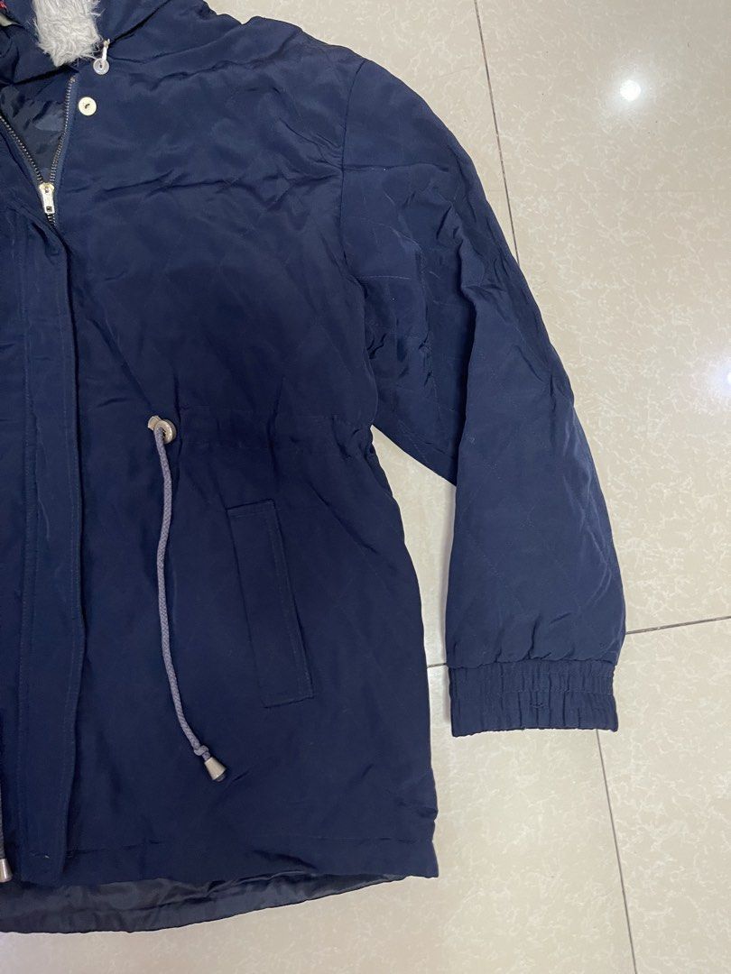 Navy Blue Parka Jacket with Fur Hood (Category: Coats, Jackets and Outerwear) located in Manila. Submitted by offtherack_mnl (Listing ID 1450755505, Image 2). Description: - Navy blue parka jacket - Drawstring waist for a customizable fit - Hood with detachable faux fur trim - Elasticated cuffs for warmth - Two convenient front pockets - Ideal for chilly weather.