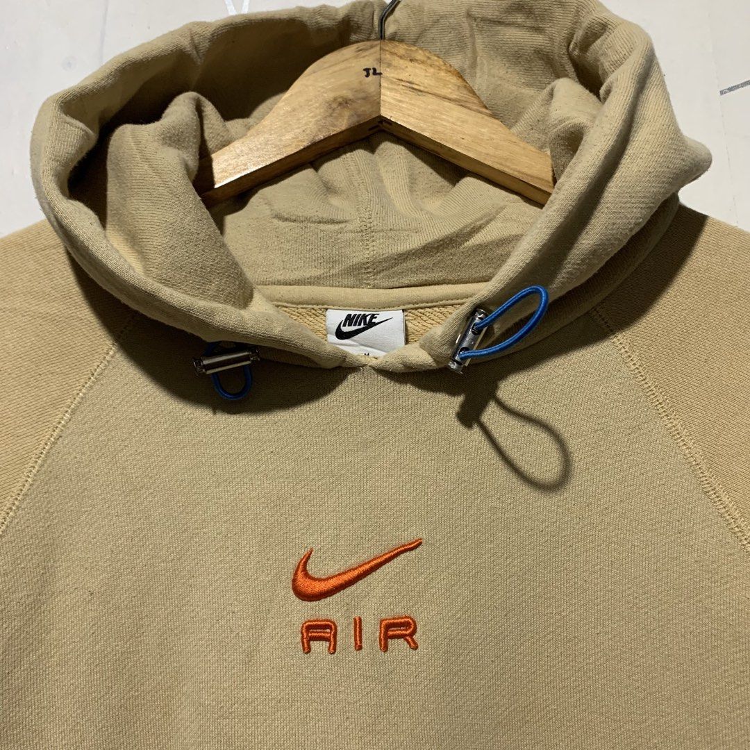 Nike Air Beige Hoodie Size M (Category: Hoodies) located in Cebu City. Submitted by stuff_paid (Listing ID 1450816938, Image 3). Description: - Beige Nike Air Hoodie - Size: Medium (M) -Width:22.5 -Length:26 - Iconic embroidered Nike swoosh and 'Air' logo on chest - Convenient front pocket - Adjustable drawstring hood - Comfortable cotton blend fabric - Ideal for everyday casual wear.