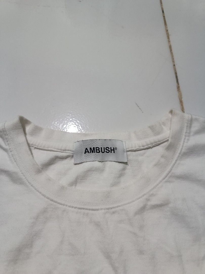 Nike x Ambush T-Shirt White (Category: Tshirts & Polo Shirts ) located in Barotac Nuevo. Submitted by gray101 (Listing ID 1450874862, Image 3). Description: - Authentic White Nike x Ambush T-Shirt - Features iconic Nike swoosh with Ambush branding - Ideal for casual and everyday wear - Crafted in Japan - Made from comfortable 100% cotton material.