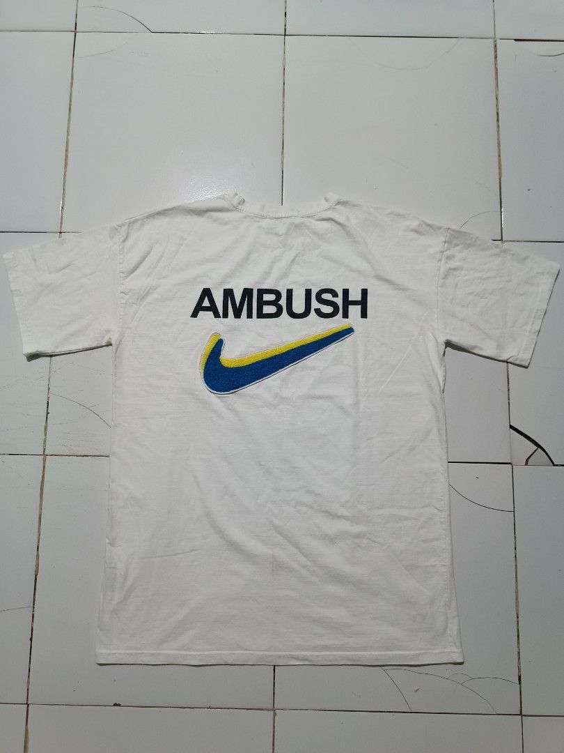 Nike x Ambush T-Shirt White (Category: Tshirts & Polo Shirts ) located in Barotac Nuevo. Submitted by gray101 (Listing ID 1450874862, Image 1). Description: - Authentic White Nike x Ambush T-Shirt - Features iconic Nike swoosh with Ambush branding - Ideal for casual and everyday wear - Crafted in Japan - Made from comfortable 100% cotton material.