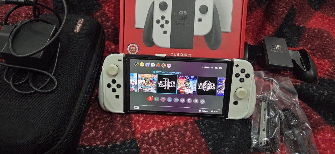 Nintendo Switch OLED (Category: Nintendo) located in Rizal. Submitted by grayp (Listing ID 1450775973, Image 3). Description: Nintendo Switch OLED Model (2022) + Accessories + Game Selling my Nintendo Switch OLED (2022 model). Used, but still fully functional and well taken care of. Included: • Nintendo Switch OLED console • Original Joy-Cons (all buttons working; some buttons feel a bit stiff from use. Suggestion: Buy new ones so your Switch wil