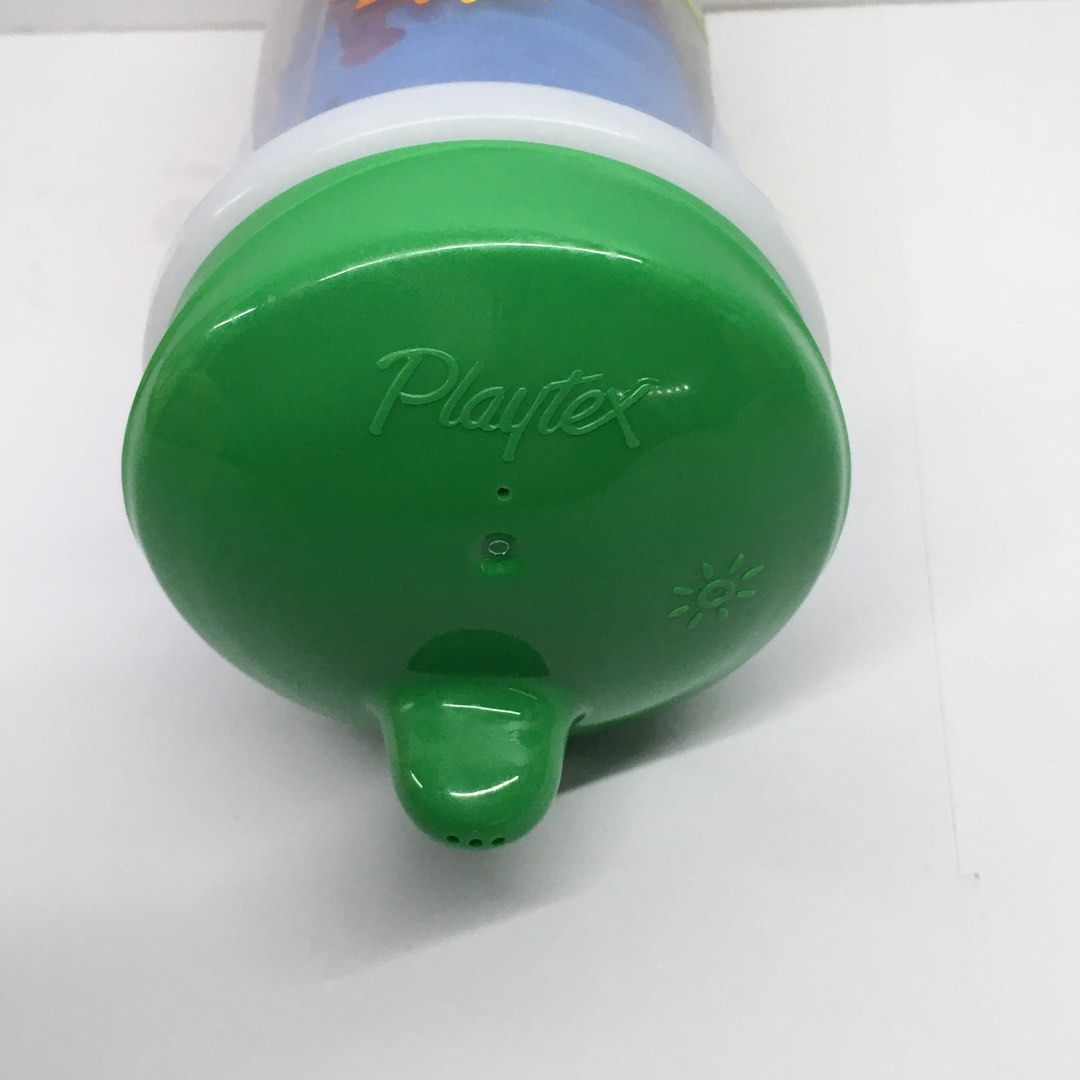 Playtex Sippy Cup Toddler Training Cup Sea Turtle Design (Category: Weaning & Toddler Feeding) located in Quezon City. Submitted by goodz4good (Listing ID 1450798923, Image 3). Description: - Cute Playtex sippy cup featuring a fun sea turtle and underwater friends design. - Green lid with a convenient spout for easy sipping. - Ideal for toddlers transitioning to independent drinking. - Ergonomically designed for little hands to hold easily. - Eng