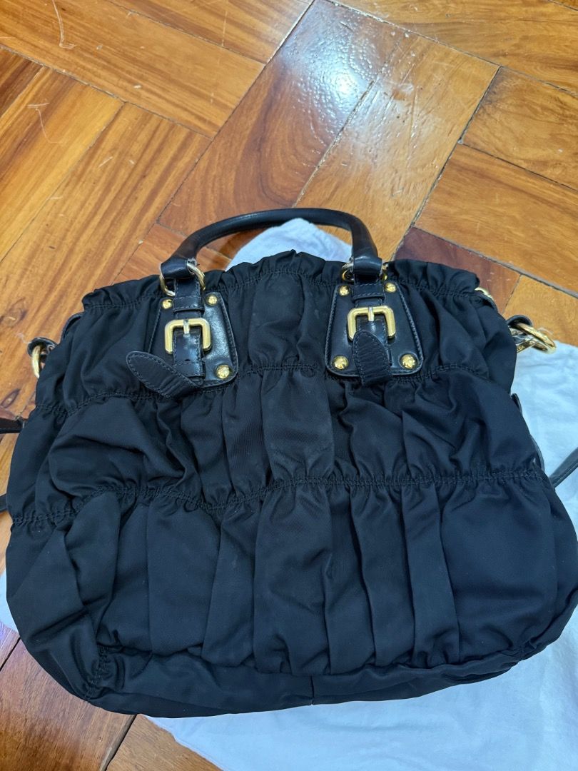 Prada Black Gaufre Tessuto Nylon (Category: Luxury Bags & Wallets) located in Quezon City. Submitted by bianxcloset (Listing ID 1450753811, Image 3). Description: - Authentic Prada bag - Color: Black - Material: Ruched nylon with leather handles - Hardware: Gold - Includes: Detachable shoulder strap and original dust bag - Features: Spacious interior, versatile for everyday or special occasions.